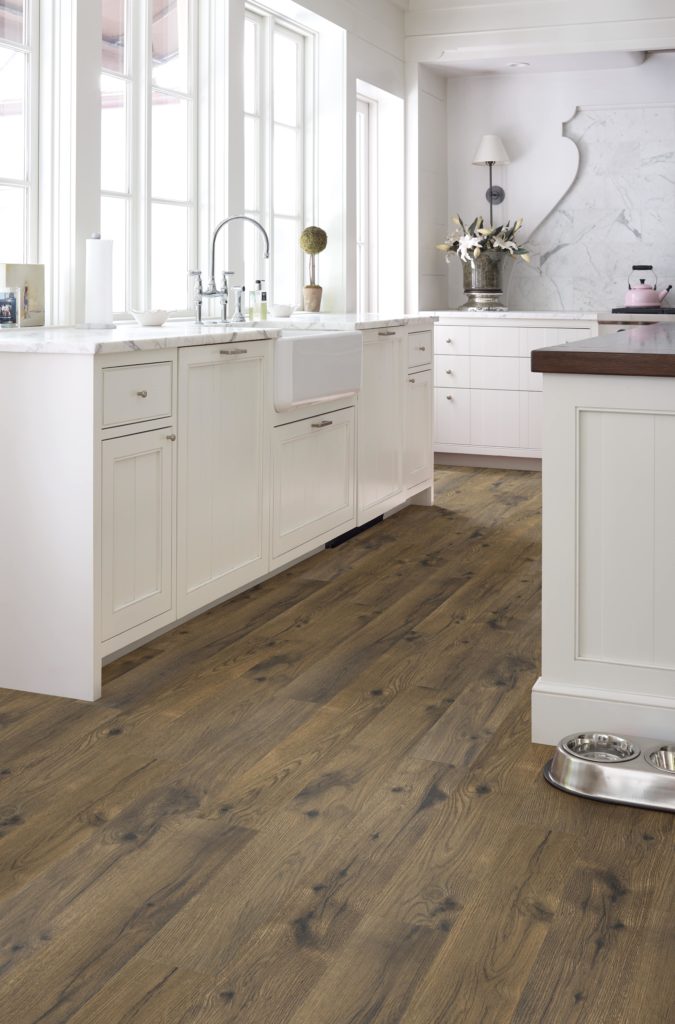 white kitchen with wide plank laminate floor