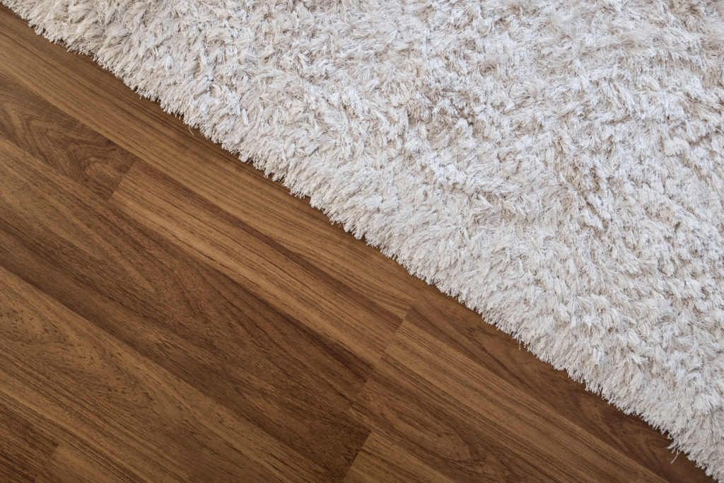 Carpet Vs Laminate The Real Pros, Can You Put Area Rug On Vinyl Plank Flooring