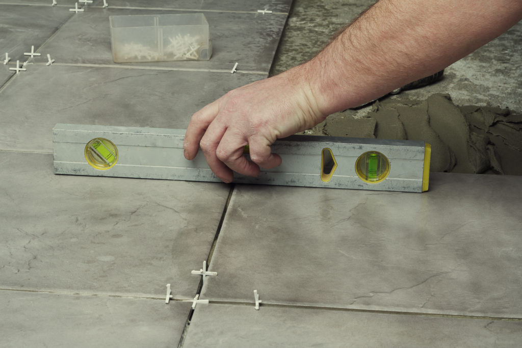 Leveling and spacing floor tiles installation