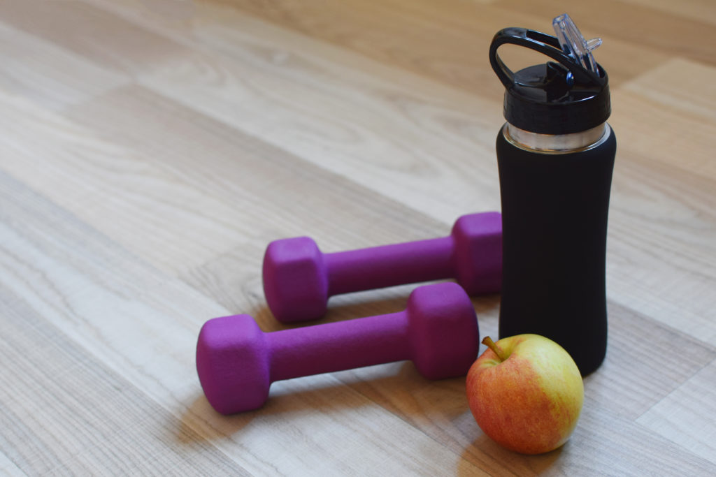 Water bottle, weights, and apple on laminate floor super durable.