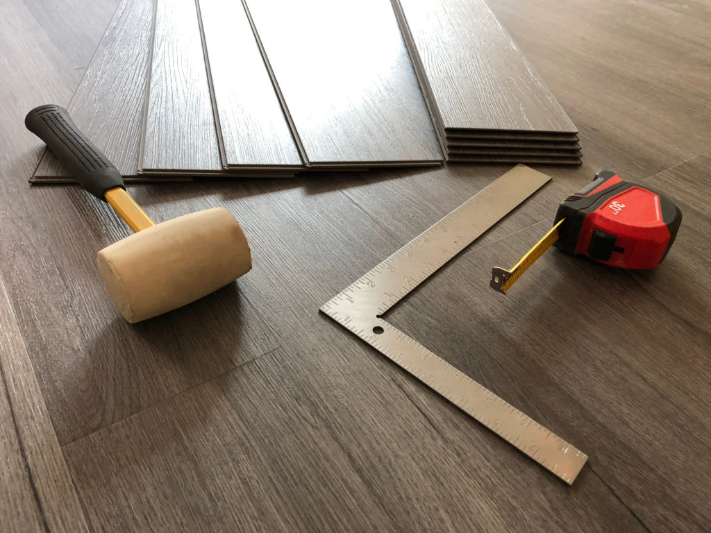 Wood-look vinyl plank flooring waiting to be installed