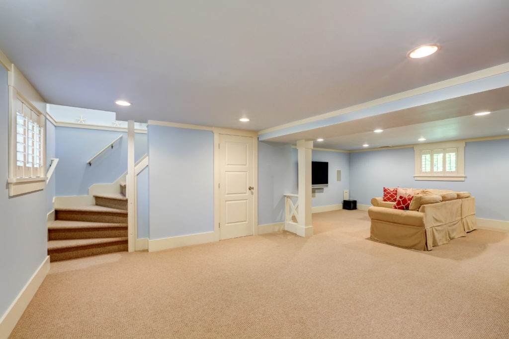A carpeted light-colored basement flooring idea