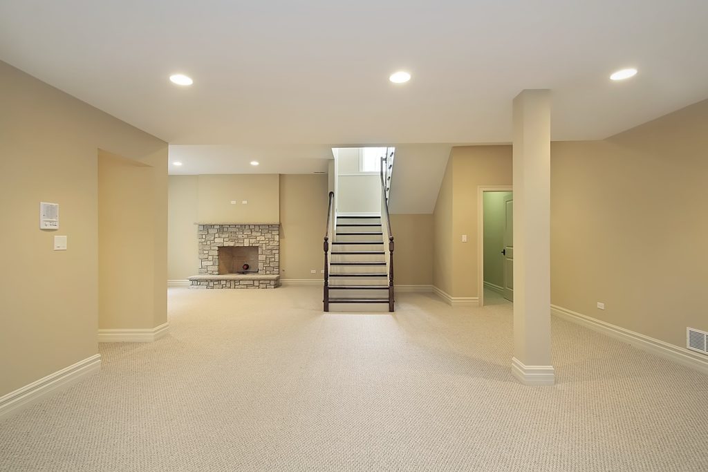 Carpeted basement flooring looking at stairs
