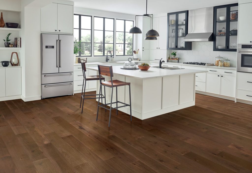 Bruce hickory engineered wood flooring in a kitchen with white cabinets