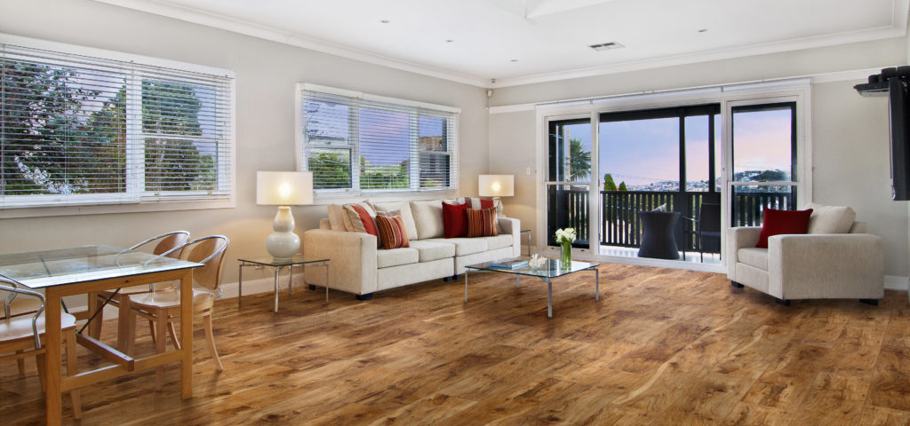 wood-look vinyl flooring in a living room with a white couch